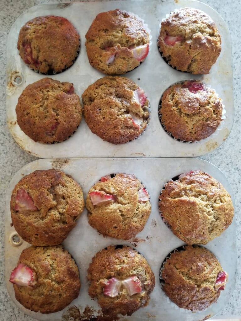 strawberry banana muffins in muffin pan after baking