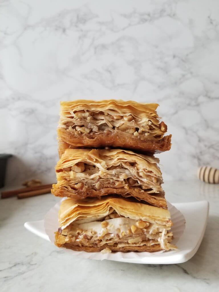 the best baklava stacked on a plate