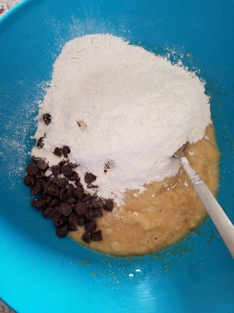 Banana mixture with the flour mixture and chocolate chips before combining.