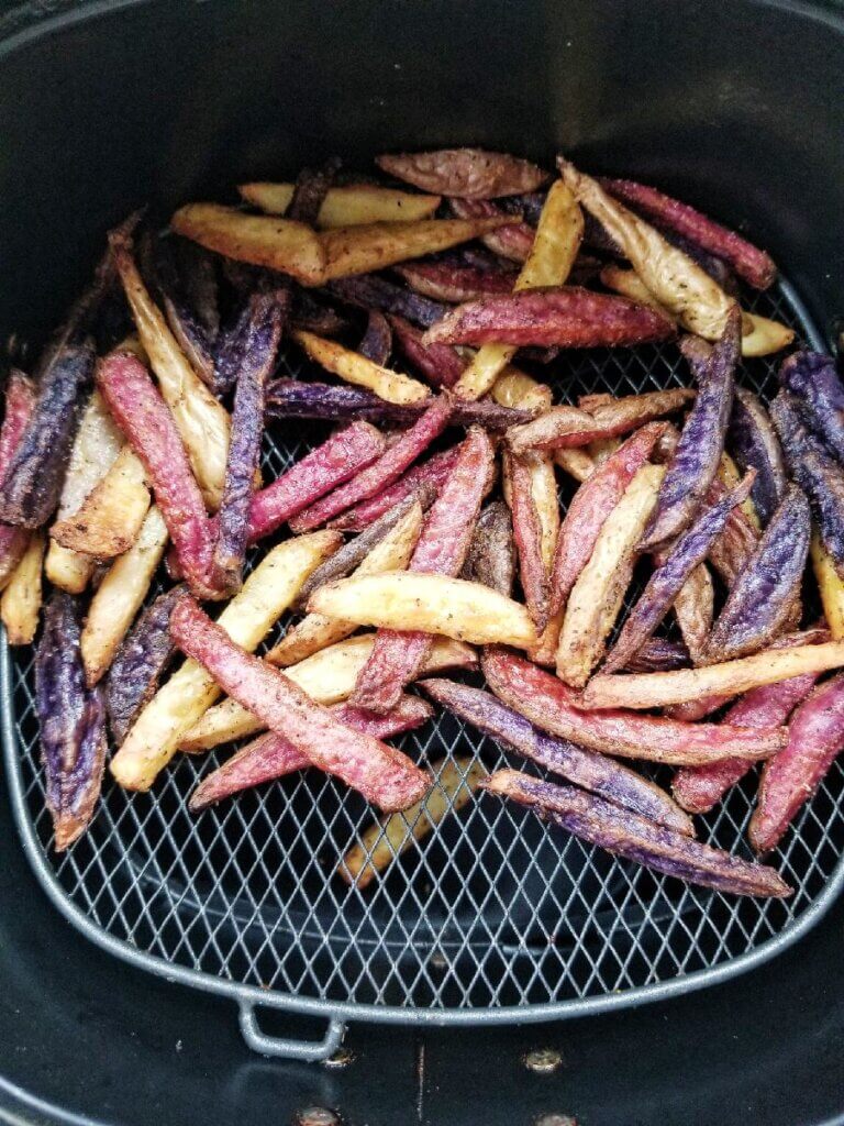 Air Fryer Rainbow Potato Fries in the air fryer basket