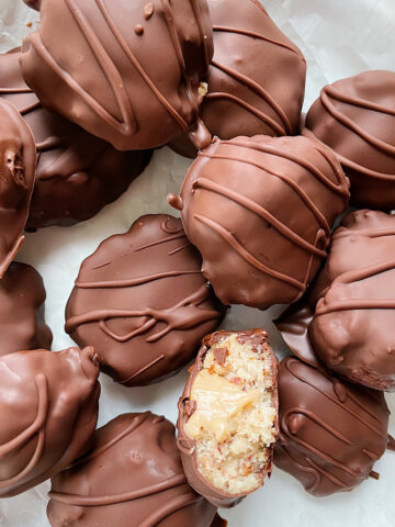 chocolate dipped almond pulp cookies with date caramel