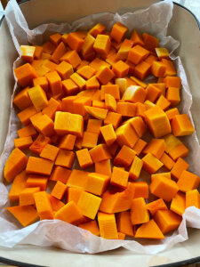 cubed butternut squash on a baking sheet
