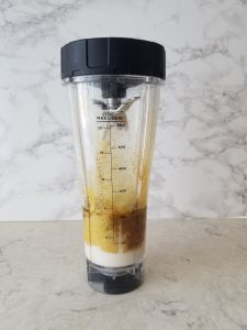 caesar salad dressing ingredients in a blender