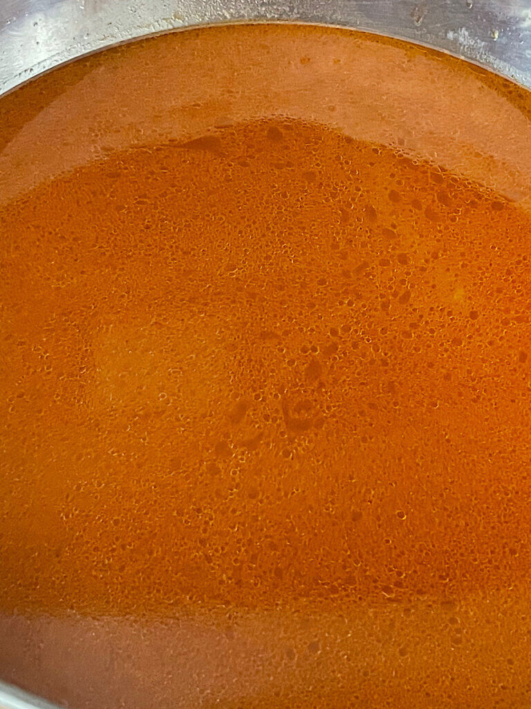 tomato chicken kabsa broth before rice is cooked