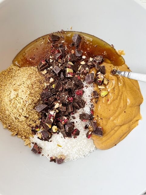 Healthy Chocolate Chip Oat Balls ingredients in a grey mixing bowl