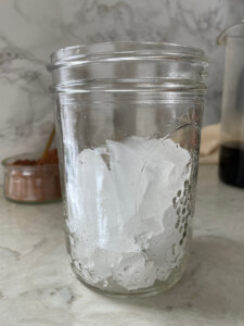 mason jar filled half way with ice cubes