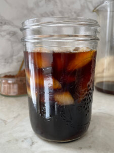 mason jar filled with iced cold brew coffee