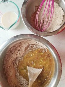 mixing chocolate zucchini cake batter