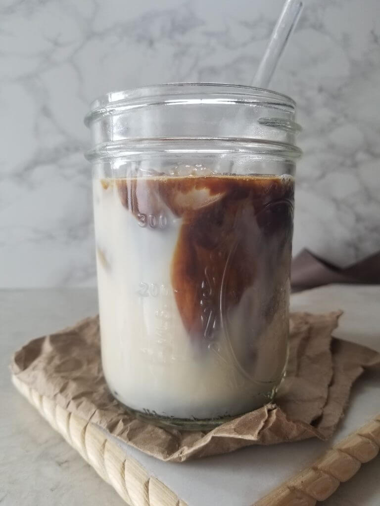 milk with a shot of espresso before stirring it in