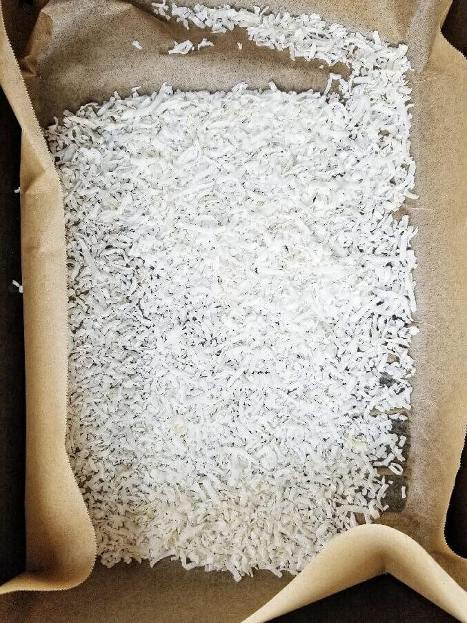 coconut flakes on a baking sheet
