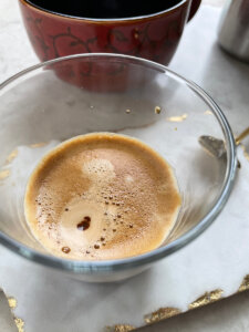 espresso brewed on top of a dark chocolate truffle