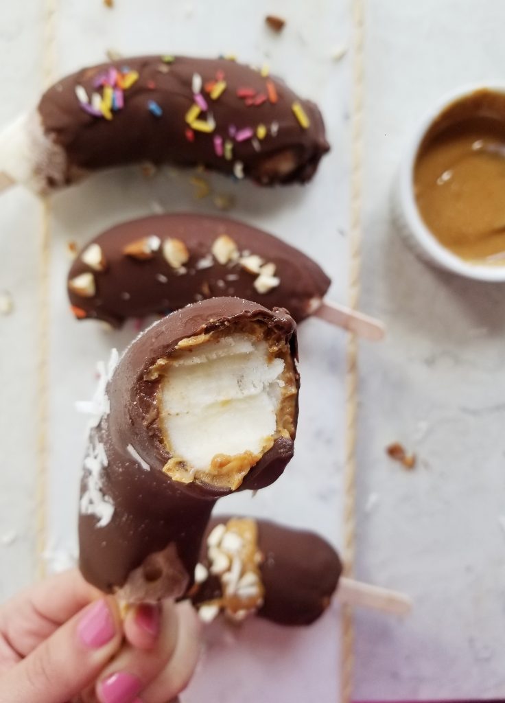 bite shot of the frozen chocolate covered bananas with peanut butter