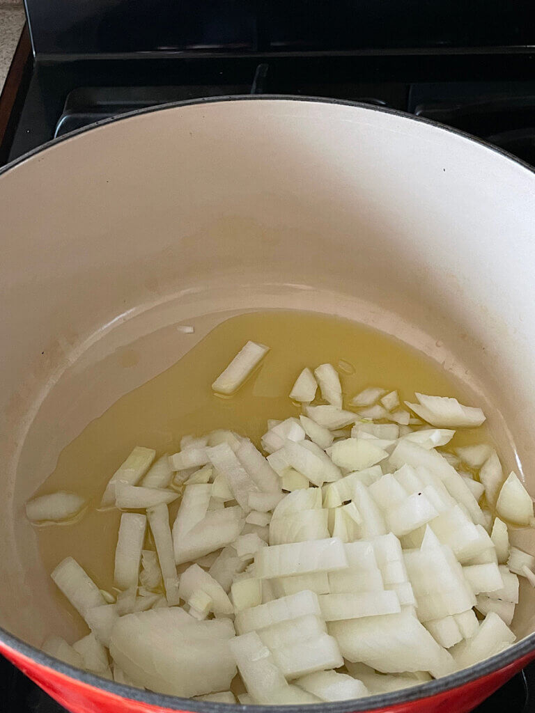 cooking onions for healthy broccoli cheddar soup