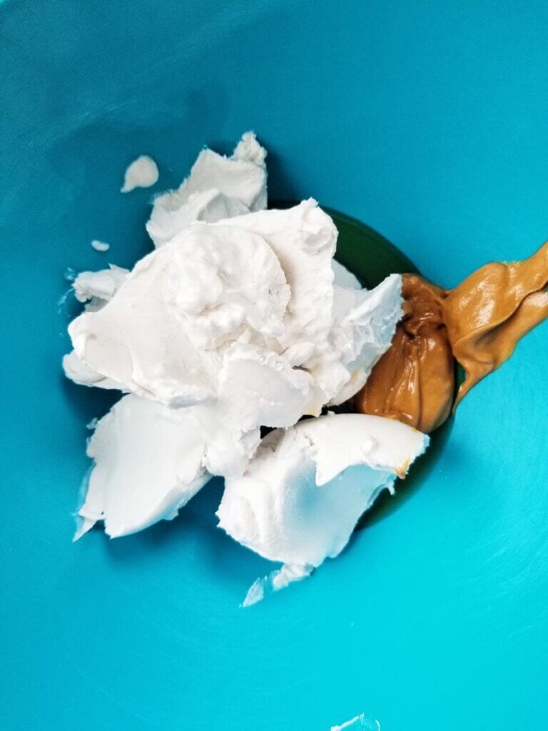 hard coconut milk, peanut butter, and maple syrup in a mixing bowl
