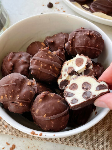 healthy cannoli balls dipped in dark chocolate coating