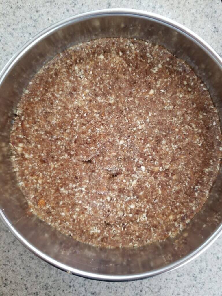the crust pressed into the bottom of the spring form pan