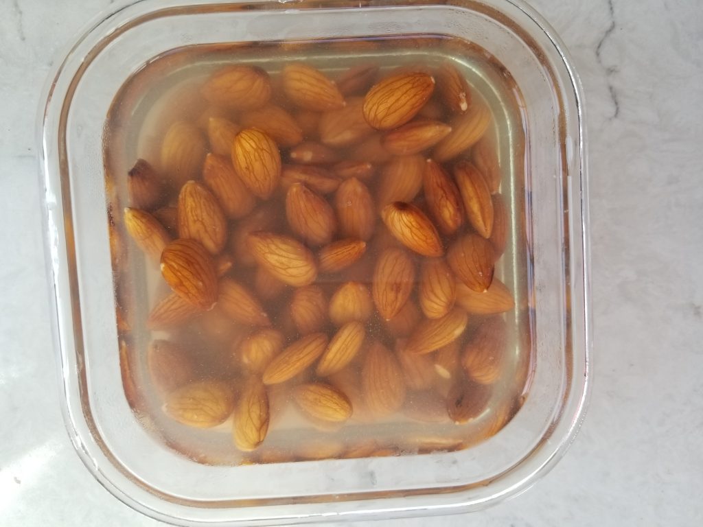 soaked almonds in a glass dish