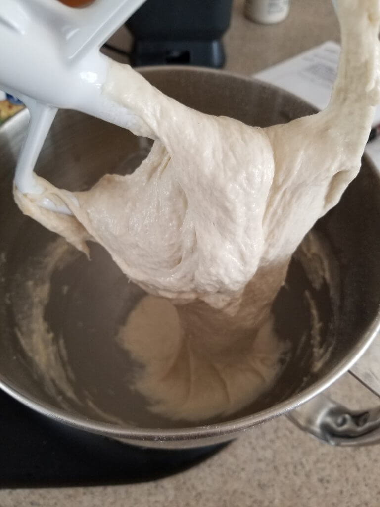paddle attachment with thin dough on it