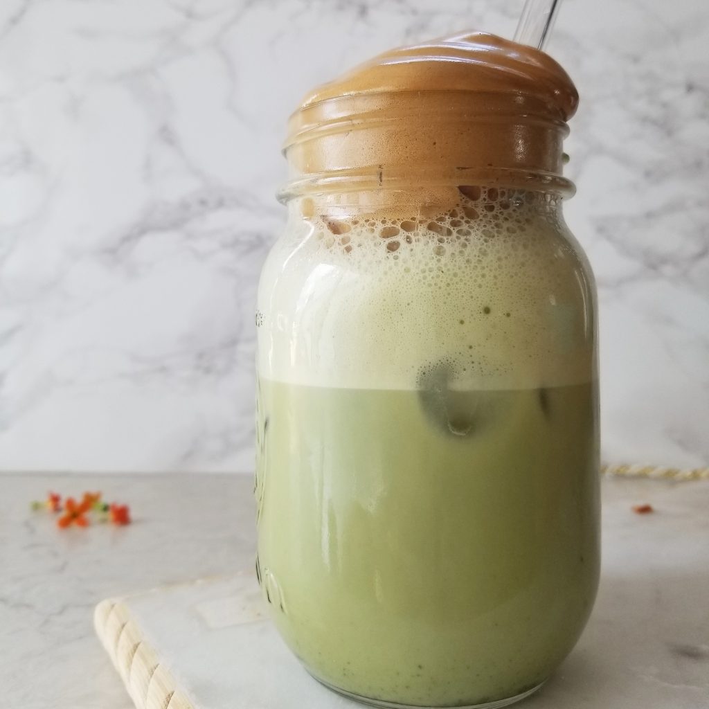 matcha latte with whipped coffee on top