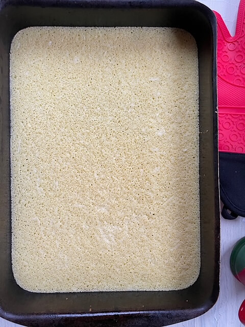 first layer of the basbousa with cream cake