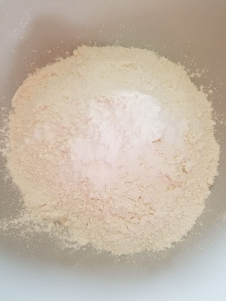 Bowl of gluten free flour, baking powder, and baking soda