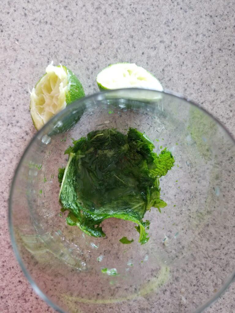 crushed mojito mint leaves in a glass