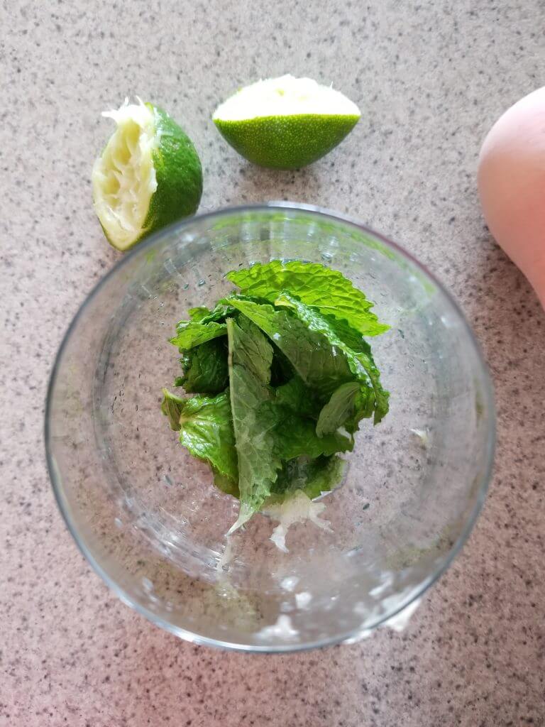 mint leaves in a glass with lime juice