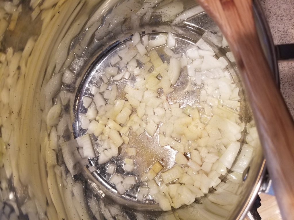 sauteing onions in the large stock pot