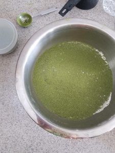 sifting matcha macaron flour