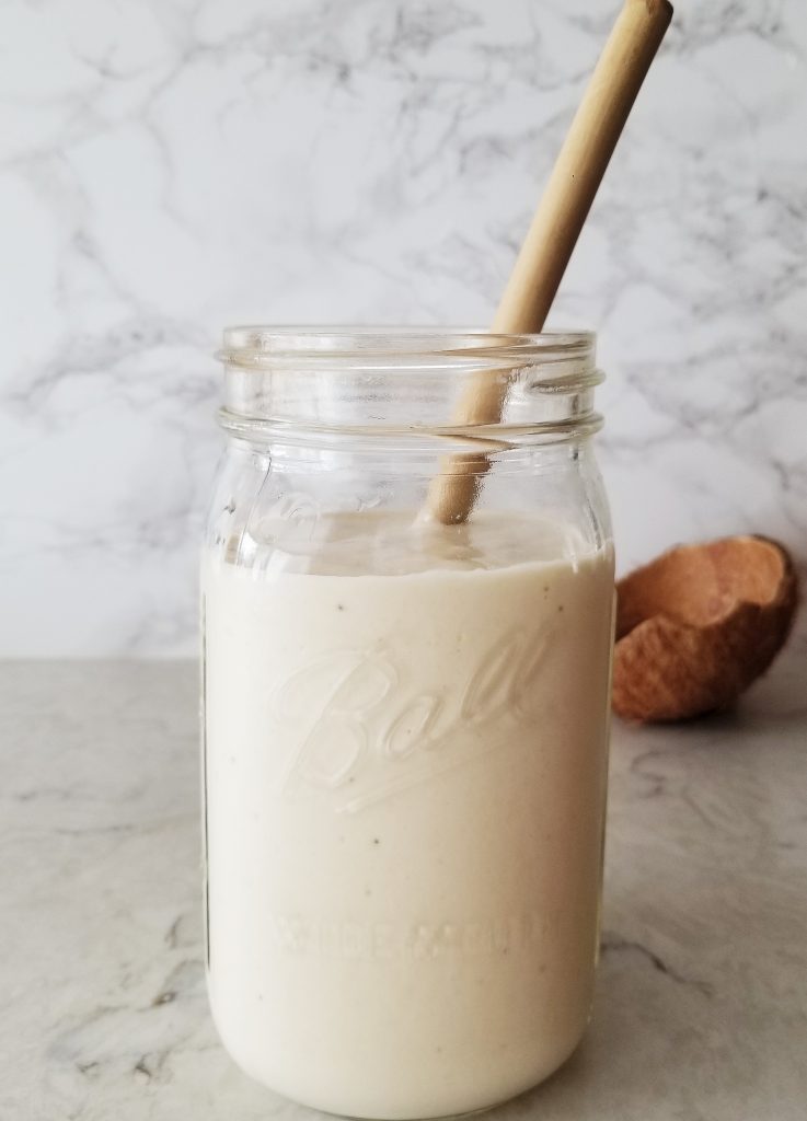 healthy pina colada mocktail in a mason jar