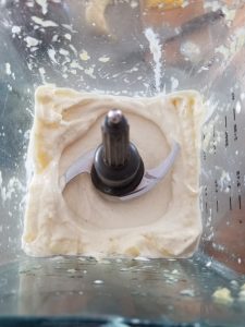 pineapple banana smoothie in a blender with a perfectly smooth texture