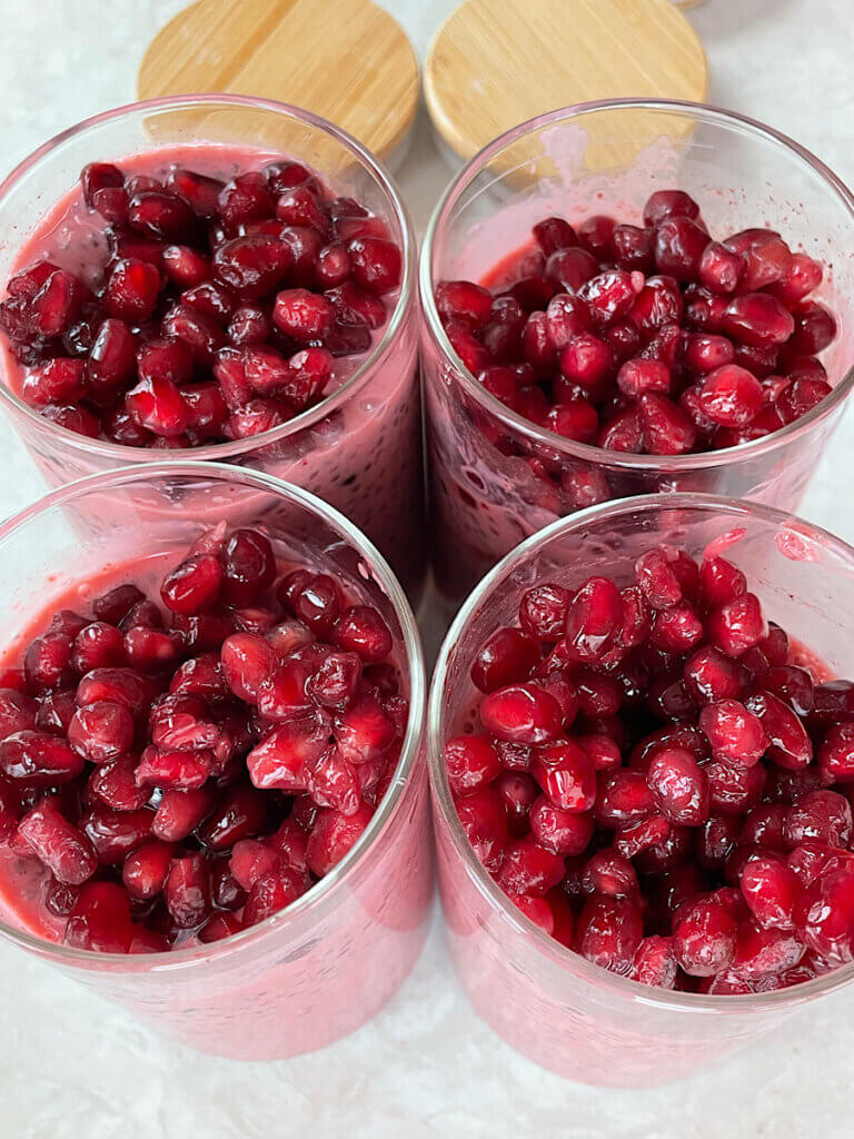pomegranate on top of chia pudding before soaking in the fridge