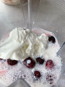 Pomegranate smoothie recipe with milk in a blender
