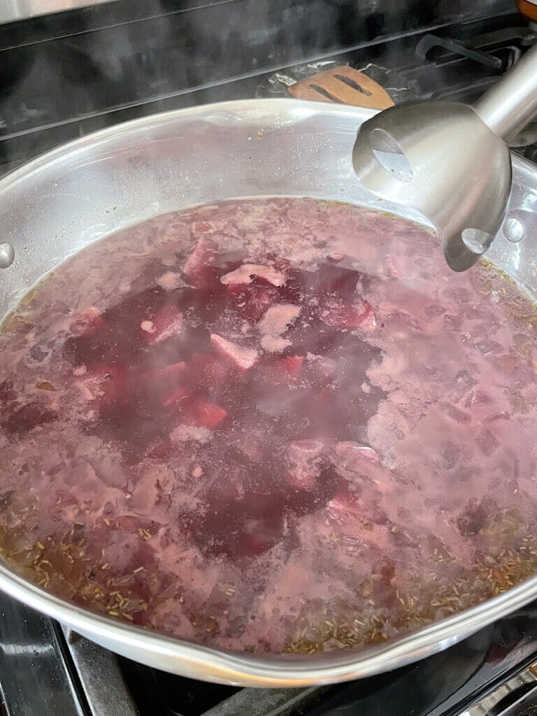 purple sweet potatoes cooking in bone broth and spices