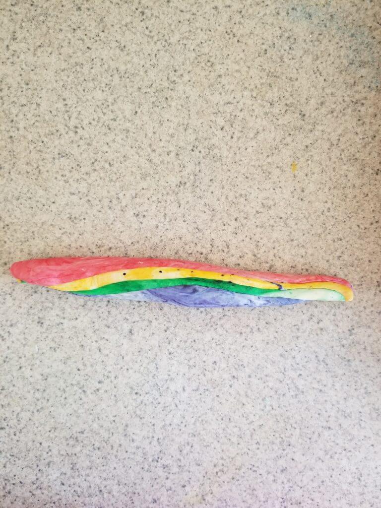 rolling the rainbow dough