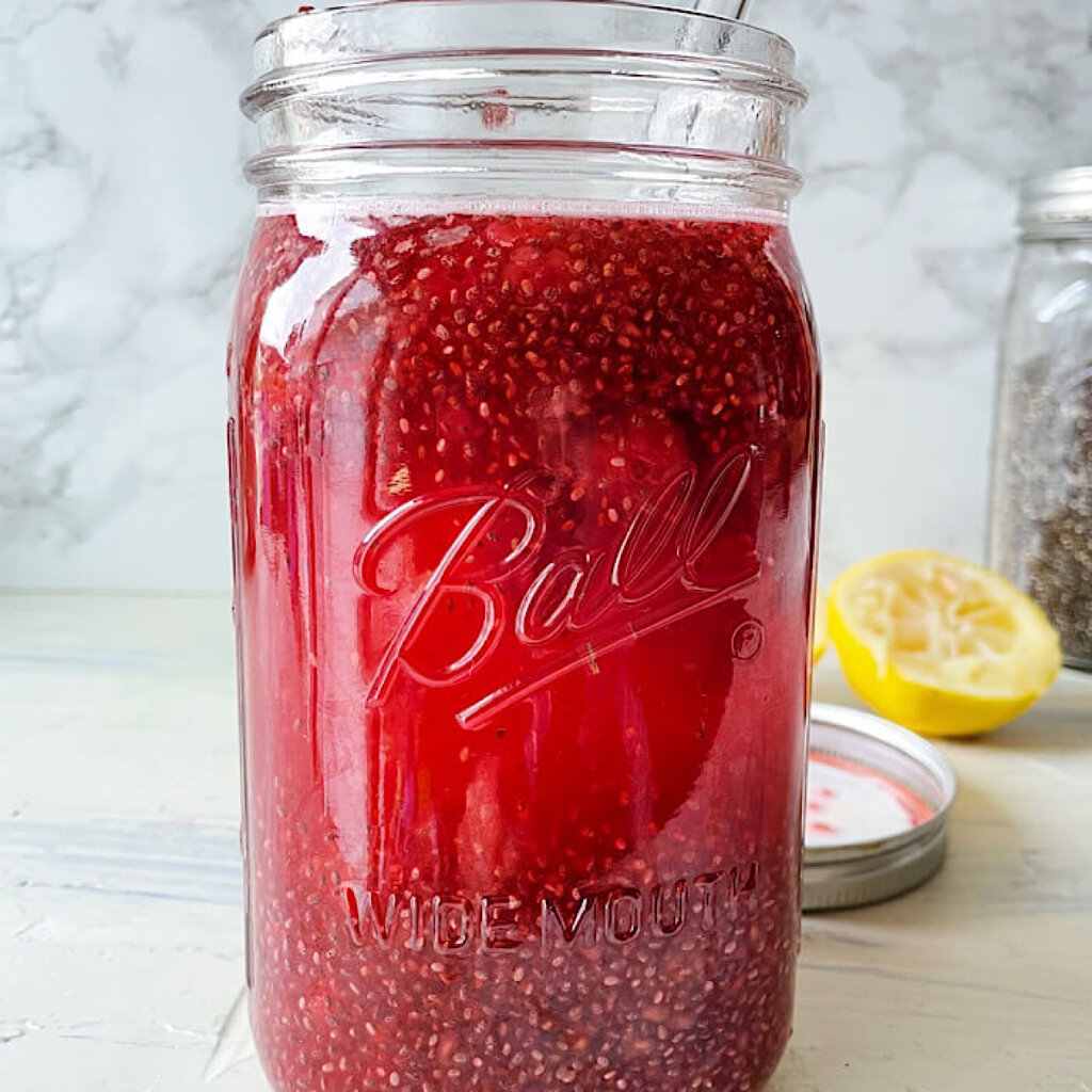 Raspberry Lemon Chia Water in a mason jar