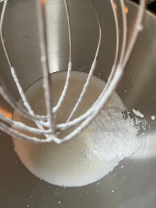 thickened heavy cream with powdered sugar