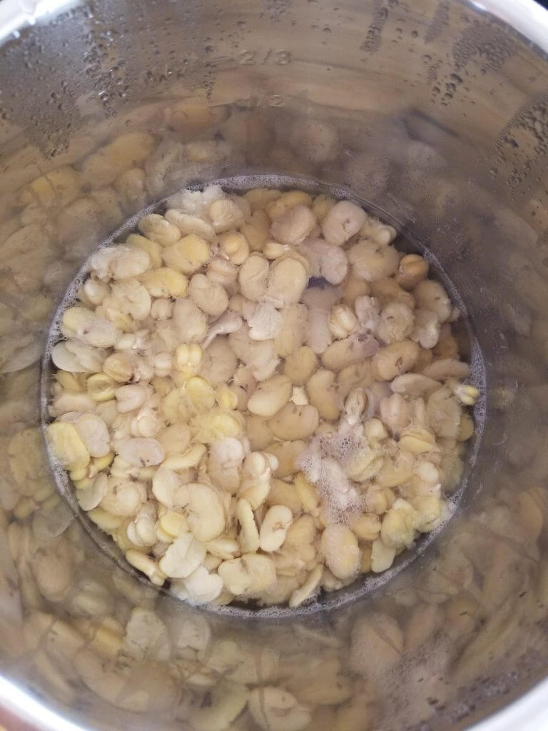 pan with mushy fava beans from steaming them