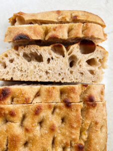 perfect bubbly sourdough focaccia bread with big air pockets