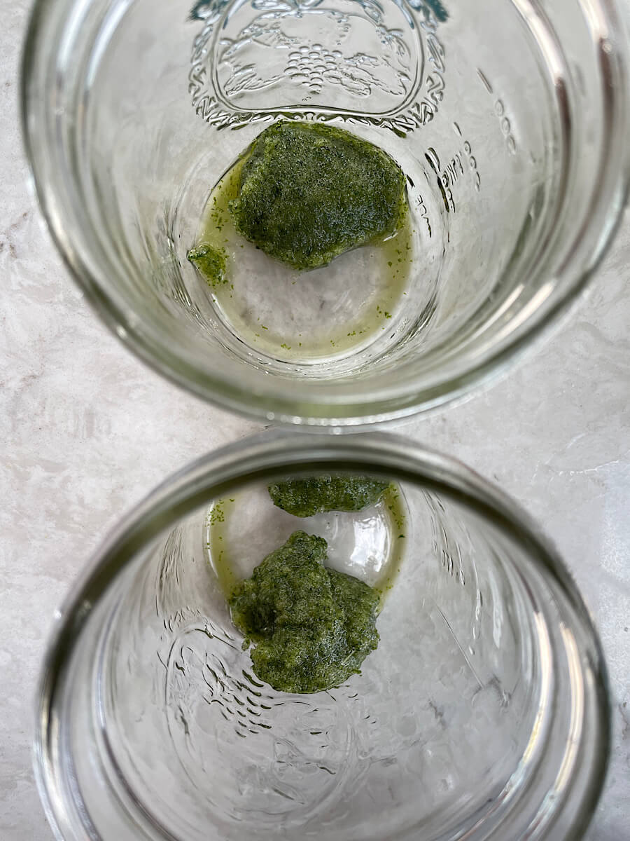 smashed mint leaves in a mason jar