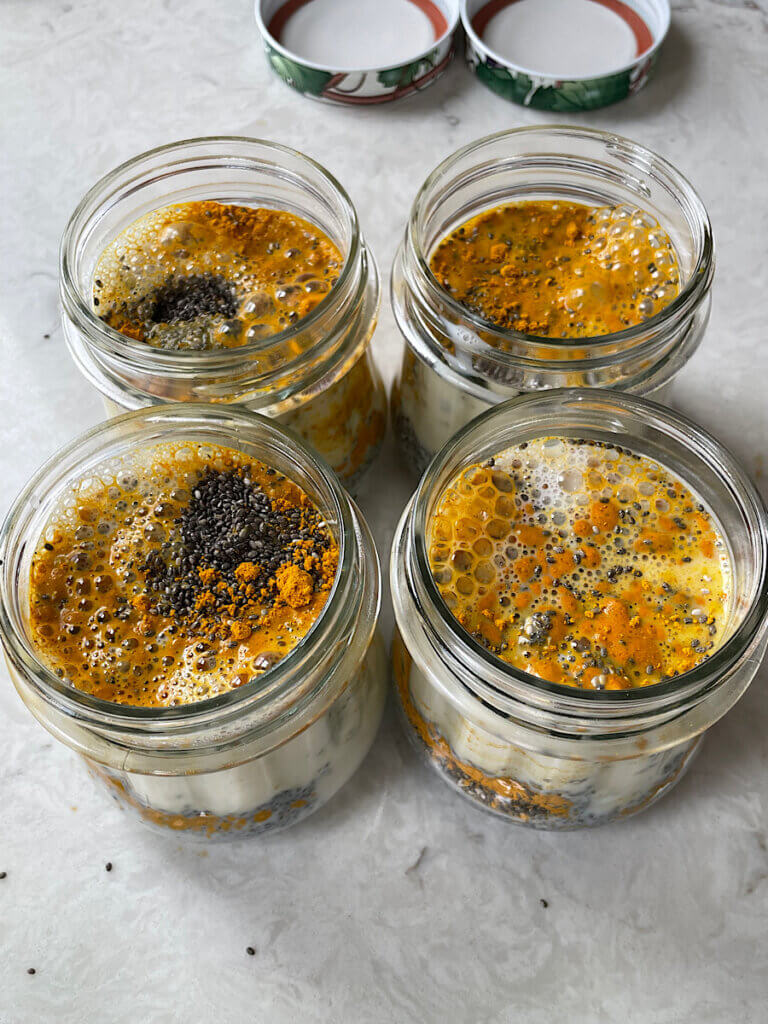 turmeric and chia seeds with milk in a mason jar