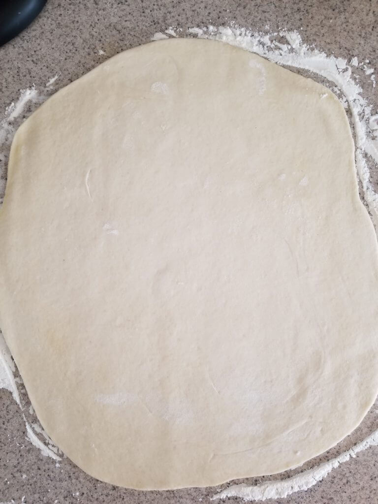 dough rolled out on the counter top
